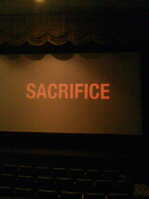 The word sacrifice on movie screen